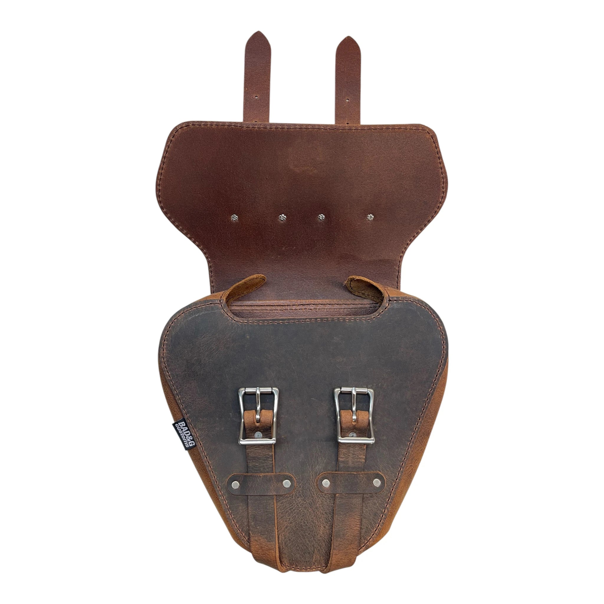 Brown leather saddlebag with metal buckles on a white background