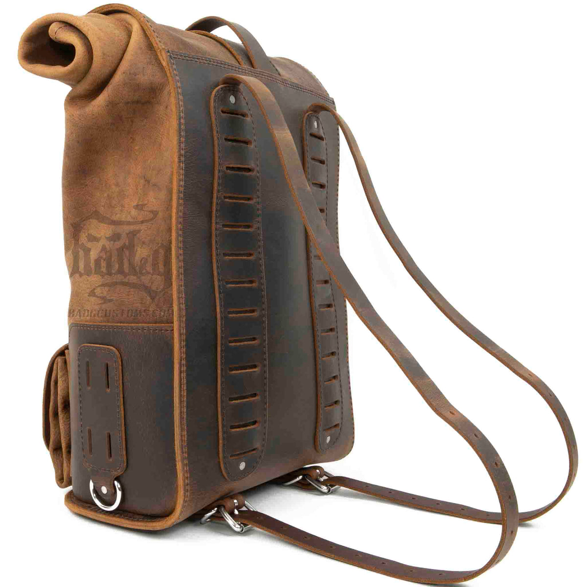 Upgrade your ride with the URB01 Rolltop Backpack Saddlebag. Unique design enables quick conversion from saddlebag to backpack. Hand crafted in USA with premium veg tan water buffalo leather and stainless steel hardware. Durable and stylish, it's the perfect fit for your motorcycle.