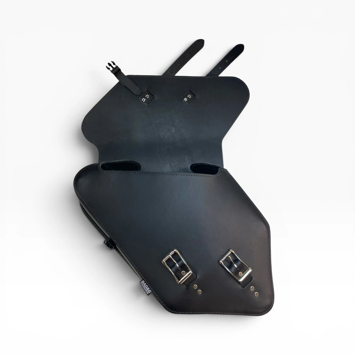 Black leather motorcycle saddle bags shown open to display the interior and buckle closures, set against a plain white background.
